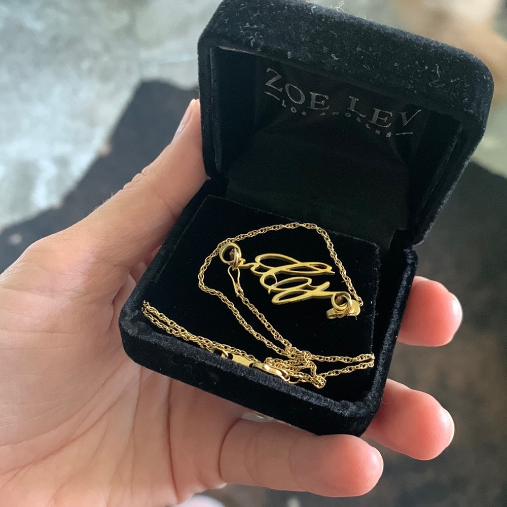 Solid 18k gold custom made nCj necklace.